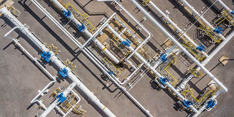 Aerial perspective of a vast oil and gas pipeline.